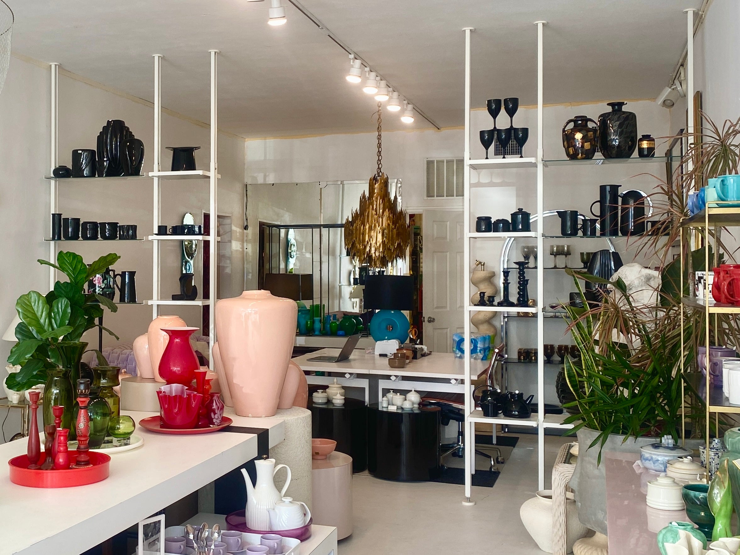 Interior of the Groupy store with shelves and tables displaying various decorative items and furniture.